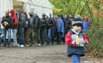 Refugees from Syria waiting to be registered at the Central Reception Centre for Asylum Seekers at