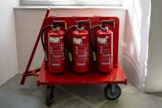 Handcart, equipped with fire extinguisher in the cloister, Salem Castle, former imperial abbey,