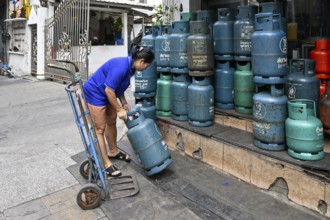 Gas cylinder woman with trolley