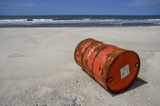 Washed up oil drum on the beach, Loango National Park, Parc National de Loango, Ogooué-Maritime