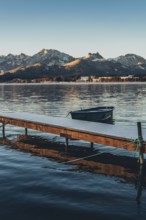 Frosty morning atmosphere during sunrise at Lake Hopfensee in the Allgäu in Bavaria, Germany,