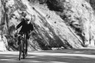 Road bike rider in spring between Lechtal and Tannheimer Tal in front of picturesque scenery of the