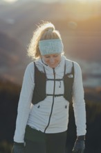 Trail running in autumn on the Jochberg on Lake Walchensee against the wonderful backdrop of the