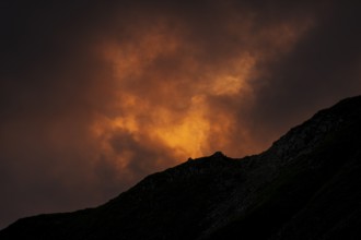 Summit in the morning light with dramatic clouds, Lech, Lechquellengebirge, Vorarlberg, Austria,