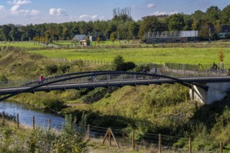 Bridge over the renaturalised Emscher in Emscherland, a new nature and water adventure park at the