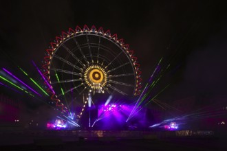 Night shot, rehearsal for New Year's Eve party, theatre, laser show, light show, Ferris wheel,