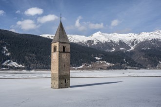 Church tower in Lake Reschen in winter, Reschen Pass, South Tyrol, Italy, Europe