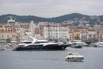 View of the harbour of Cannes and the houses and hotels behind it, including the Hotel Splendid,