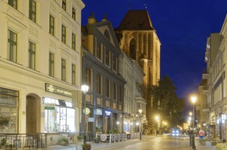 The medieval old town of Thorn illuminated in the evening. The historic city centre of Torun is a