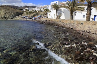 Small fishing boats and whitewashed houses, Isleta de Moro village, Cabo de Gata natural park,