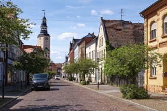 Residential and commercial buildings in Rudolf-Breitscheid-Straße, paved with cobblestones, in the