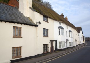 Row of old traditional cottages on the quayside in Minehead, Somerset, England, United Kingdom,