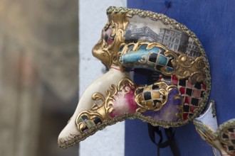 Venetian carnival mask in front of a shop, Burano, Veneto, Italy, Europe