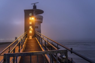 Thick fog in winter, hanging over the mouth of the Elbe into the North Sea, radar tower of the