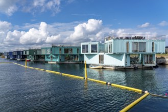 Urban Rigger, a floating village made of freight containers, for students, action against the