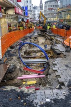 Construction site in the city centre of Wuppertal, laying of new pipelines, various supply lines