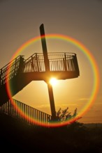 Viewing platform of the Pluto spoil tip at sunset with circular aberration, Herne, North