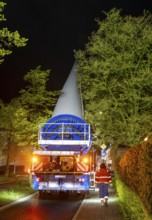 Transport of a 68 metre long, 22 tonne blade of a wind turbine, here in Breckerfeld-Waldbauer, with