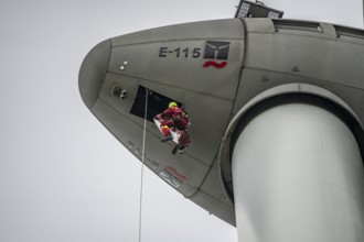 Height rescuers from the Oberhausen professional fire brigade practise abseiling from a wind