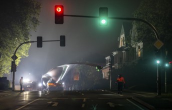 Transport of a 68 metre long, 22 tonne blade of a wind turbine, here in Breckerfeld, with a