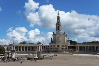 Spacious square in front of a basilica with people and blue sky, Basilica of Our Lady of the