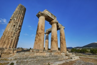 Archaic Temple of Apollo, Doric columns, Sun illuminates ancient stone columns and ruins of a