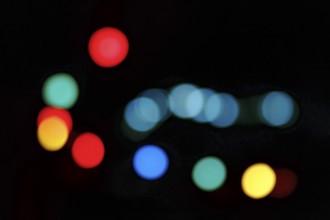 Bokeh balls, abstract dark background with colourful lights, night shot, Barcelona, Spain, Europe