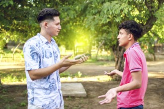 Young man chatting with young man, two people arguing WITH COPY SPACE