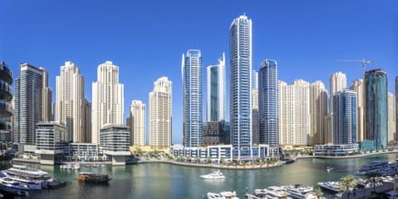 Dubai Marina skyline skyscrapers with yachts skyscrapers living on the water panorama in Dubai,