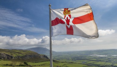 The flag of Northern Ireland flutters in the wind