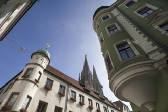 Towers of Regensburg Cathedral right and left historic town houses in the section, Regensburg,