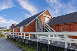 Typical architecture of Greenland Ilulissat with colored houses located near fjords and icebergs