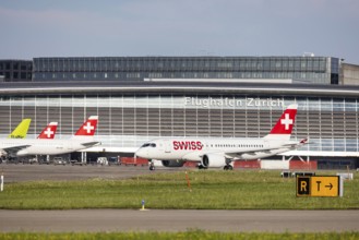 Swiss airline aircraft at Zurich Airport. Terminal and tower. Zurich, Switzerland, Europe