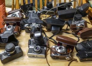 A collection of vintage cameras on display at auction, UK