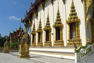 Gilded and decorated windows of the prayer hall in the temple Wat Plai Laem, Koh Samui, Thailand,