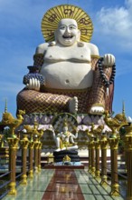 Laughing Buddha, larger-than-life statue in the Buddhist temple Wat Plai Laem, Koh Samui, Thailand,