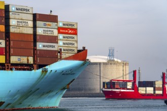 LNG import terminal tanks for liquefied natural gas in the seaport of Rotterdam, harbour tug brings