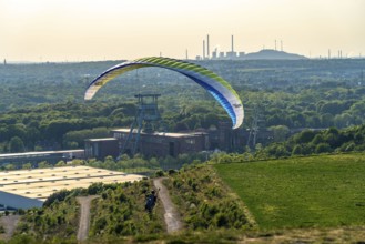 Paragliders on the Hoheward spoil tip, view to the west, North Rhine-Westphalia, Germany,