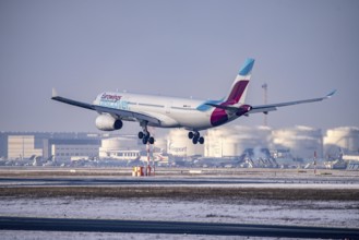 Discover Airbus A330-300 approaching Frankfurt FRA airport, fuelling depot, Fraport, in winter,