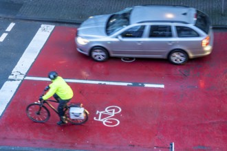 Cycle lane, space for cyclists at a traffic light crossing, marked red, cars, lorries must stop