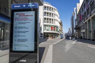 Advertising displays, give advice on correct behaviour, empty city centre, shopping street,