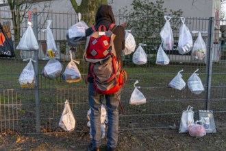 Gift fence with donations for the homeless and needy, food, hygiene articles, clothing, in Essen