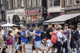 Shopping street Damrak, many tourists, visitors, Amsterdam, Netherlands