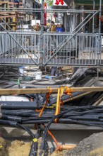 Supply lines, laid underground, exposed during a construction project, Bochum, North