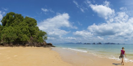 Lonely beach with tourist on Koh Yao Noi, beach holiday, beach landscape, rocks, forest,