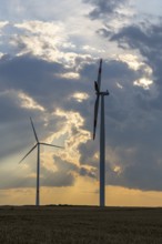 Wind farm, wind turbine, wind turbines, in front of sunset, storm clouds, Swabian Alb,