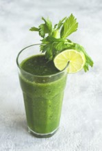 Glass with green smoothie, celery and spinach, apple and kiwi, cucumber, vegetable smoothie,