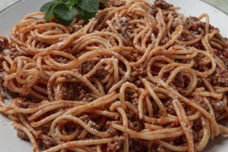 Spaghetti bolognese, in a frying pan, top view, homemade, no people