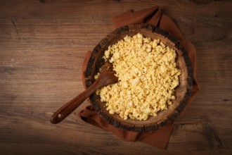 Cooked couscous, in a wooden bowl, top view, no people