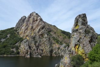 Spectacular rock formations above a river, embedded in hilly nature, Salto del Gitano, River Tagus,